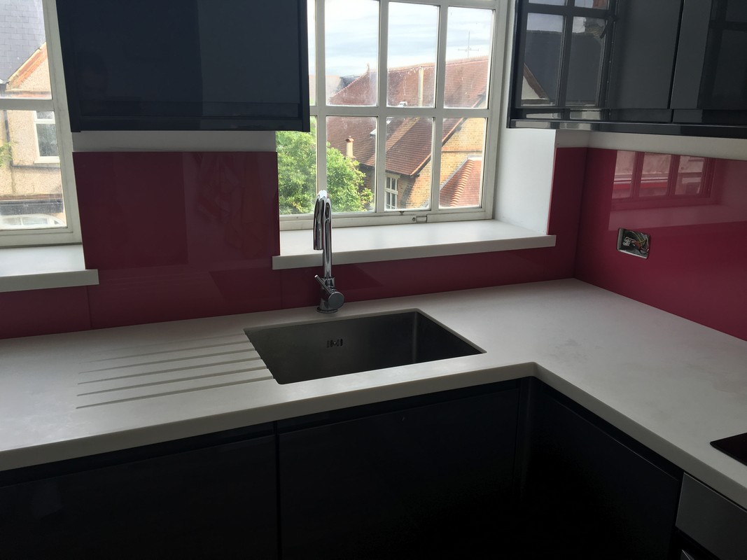 Deep plum coloured glass splashback in modern High Wycombe kitchen